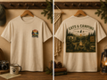 Tranquil Observation Cat Camping T-Shirt – nature-inspired cat graphic on preshrunk cotton tee, front view